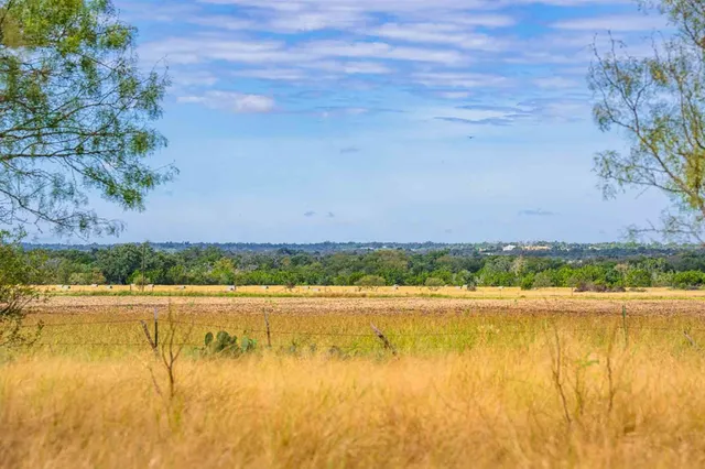a view of a yard with an outdoor space
