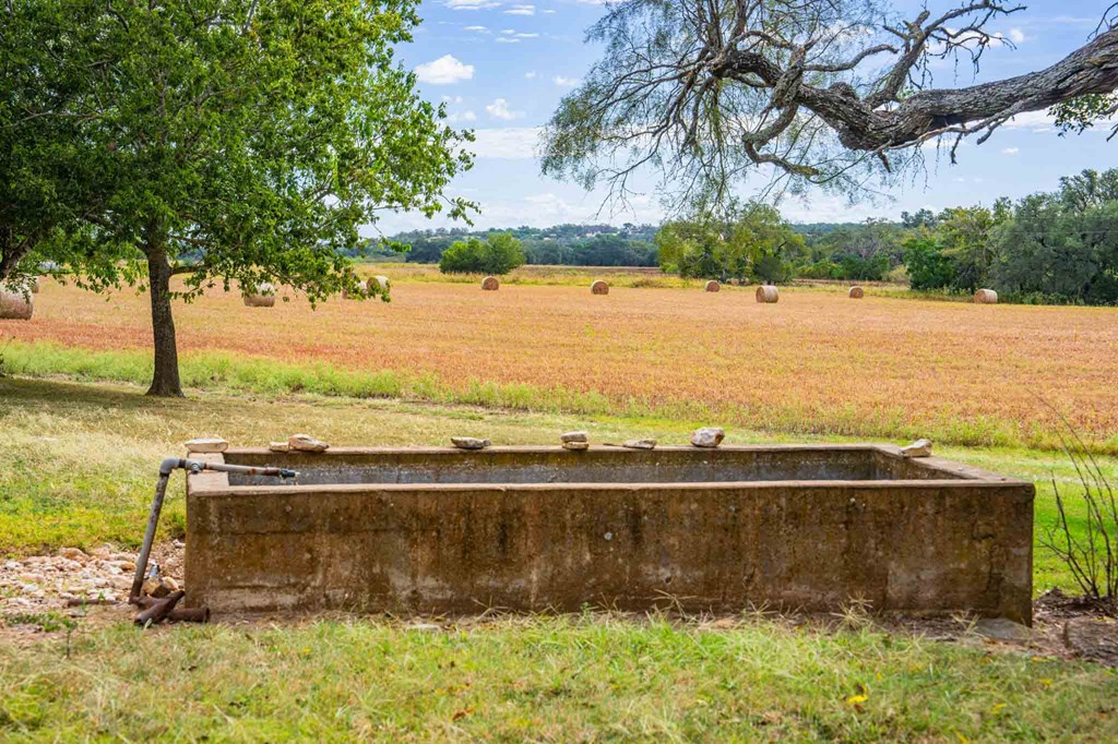 6754 North Grape Creek Road Fredericksburg, TX 78624 - Photo 42 of 47 a view of a lake with a big yard