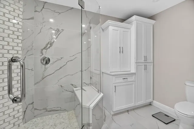 a bedroom with a large bed and a table in it