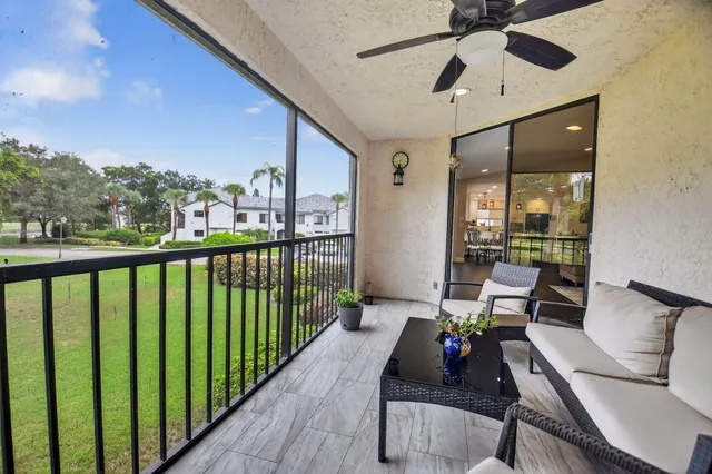 a view of a two chairs in the balcony