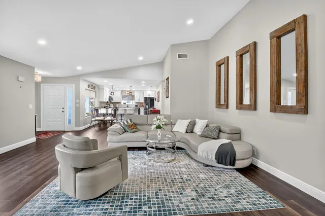 a living room with furniture and a rug