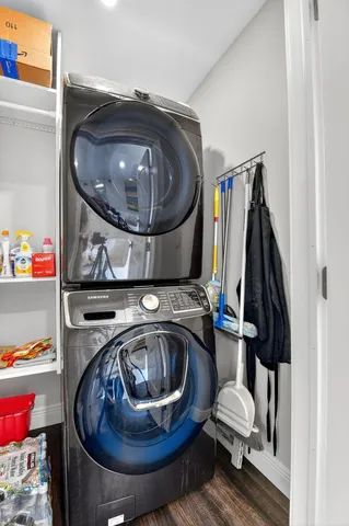 an aerial view of a house with a garden and lake view