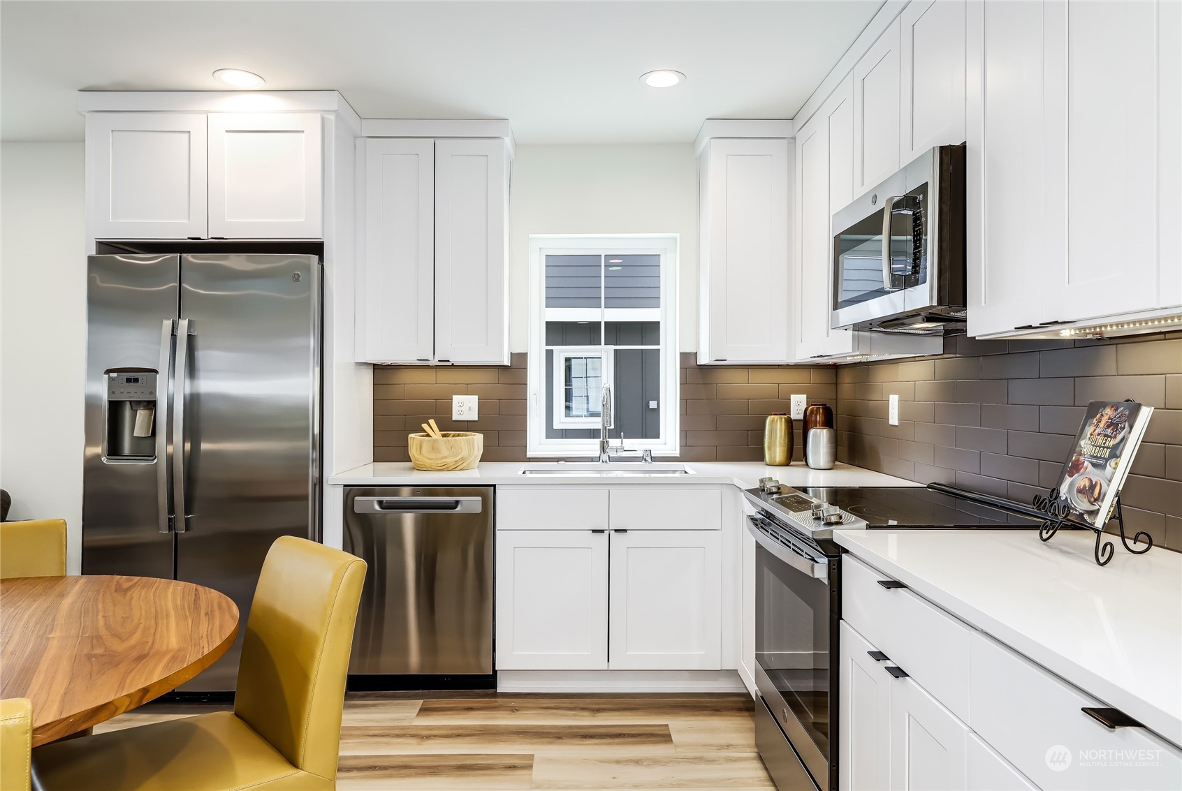 9033 15th Avenue Southwest Seattle, WA 98106 - Photo 3 of 17 a kitchen with a sink appliances and cabinets
