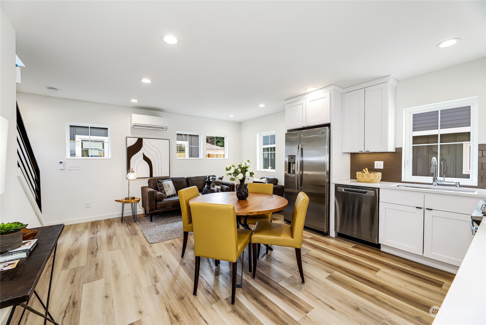9033 15th Avenue Southwest Seattle, WA 98106 - Photo 5 of 17 a view of a dining room with furniture and a kitchen