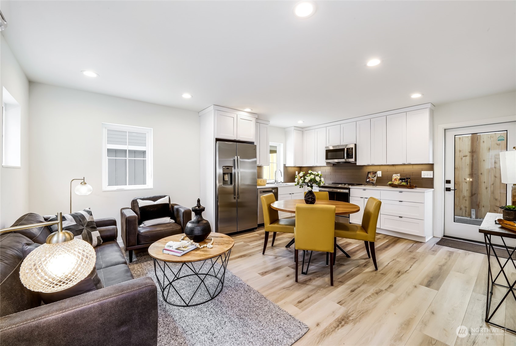 9033 15th Avenue Southwest Seattle, WA 98106 - Photo 6 of 17 a living room with furniture and kitchen view