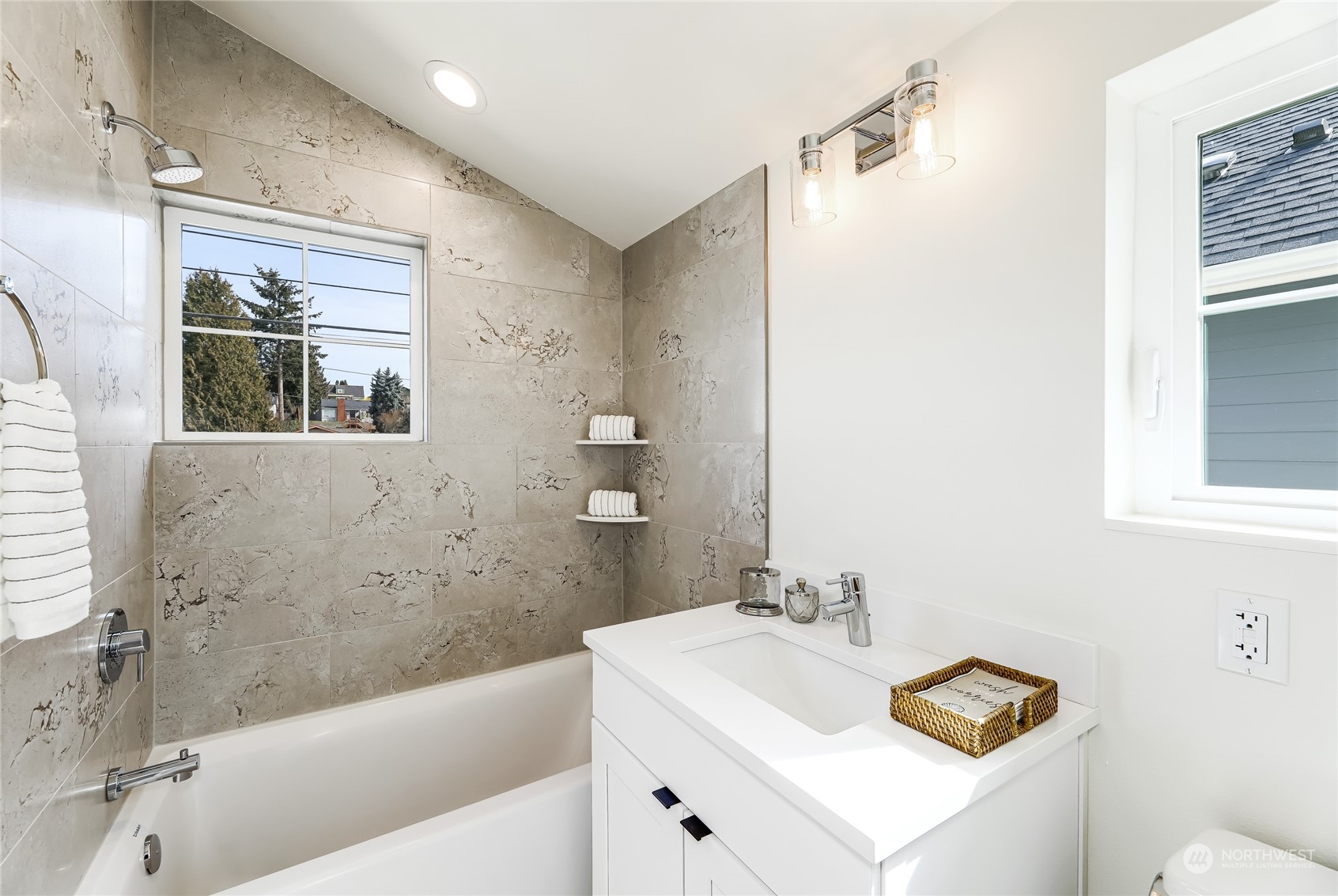 9033 15th Avenue Southwest Seattle, WA 98106 - Photo 8 of 17 a bathroom with a sink a toilet and shower