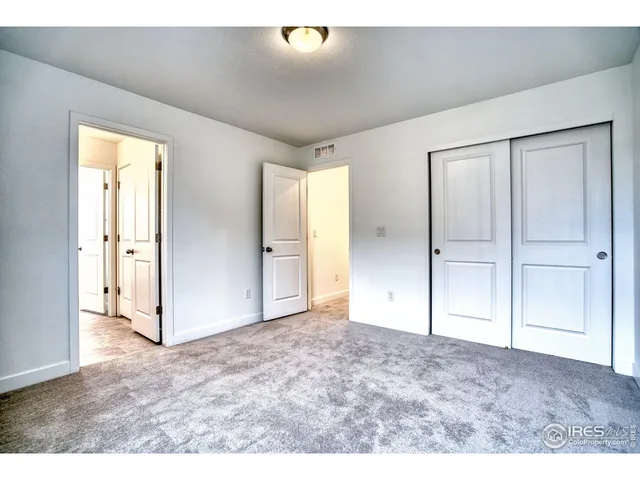 a bathroom with a sink vanity granite and a mirror