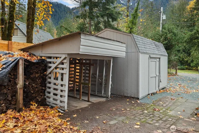 a view of a yard with large trees