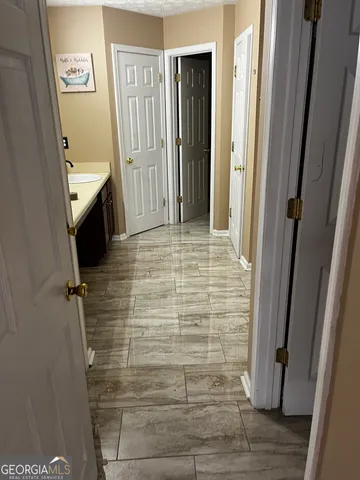 a bathroom with a sink and a shower