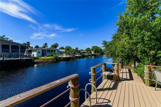 a view of a lake with outdoor seating