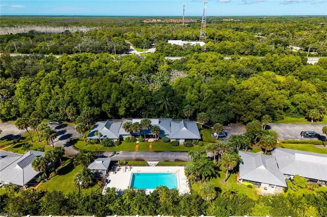 an aerial view of houses with yard