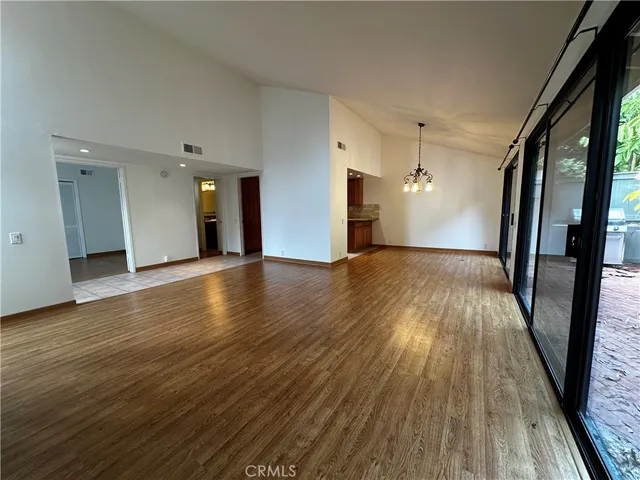 a bathroom with a sink a toilet a mirror and shower