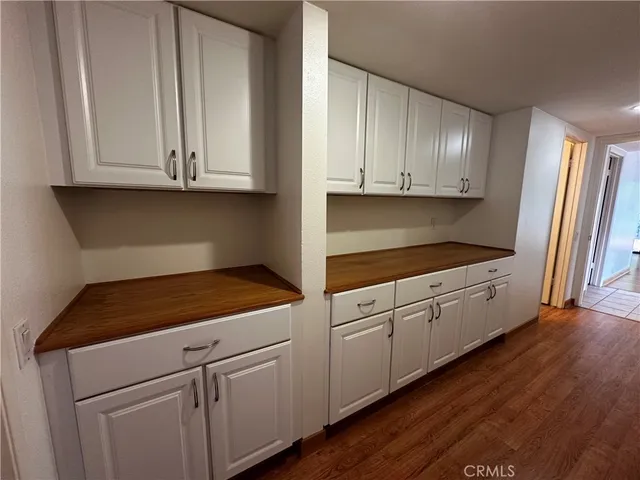 a large bathroom with a glass shower door and a sink