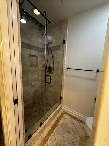 a view of a park with large trees