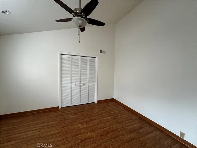 a kitchen with stainless steel appliances granite countertop a refrigerator a stove and a sink