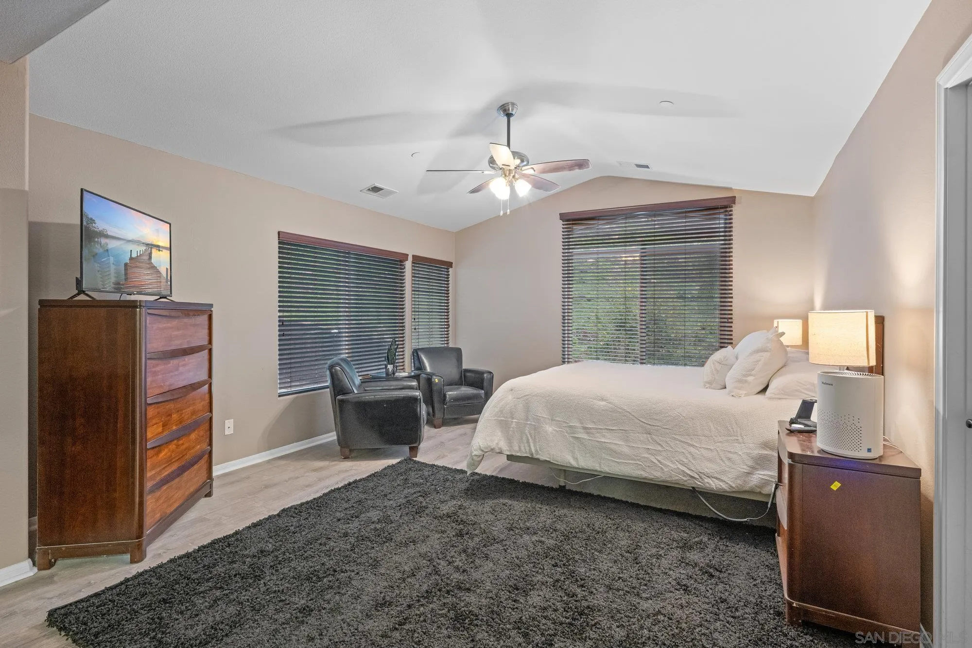 640 Dimaio Way Escondido, CA 92027 - Photo 14 of 31 a bedroom with a bed and a chandelier