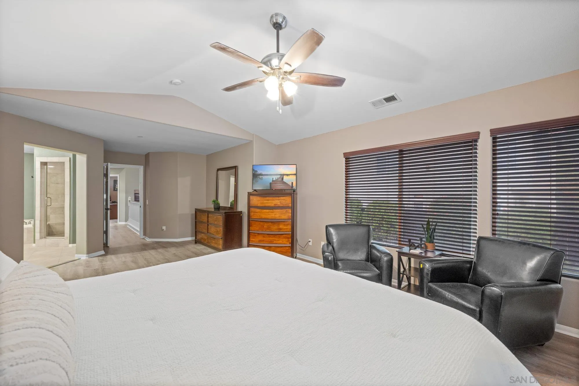 640 Dimaio Way Escondido, CA 92027 - Photo 15 of 31 a bedroom with a large bed and a large window