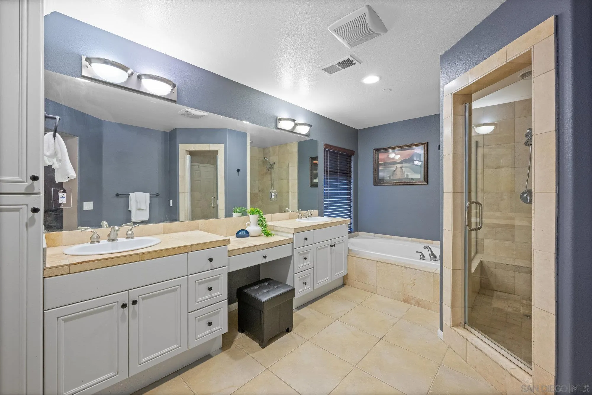 640 Dimaio Way Escondido, CA 92027 - Photo 16 of 31 a spacious bathroom with a double vanity sink a large mirror and shower
