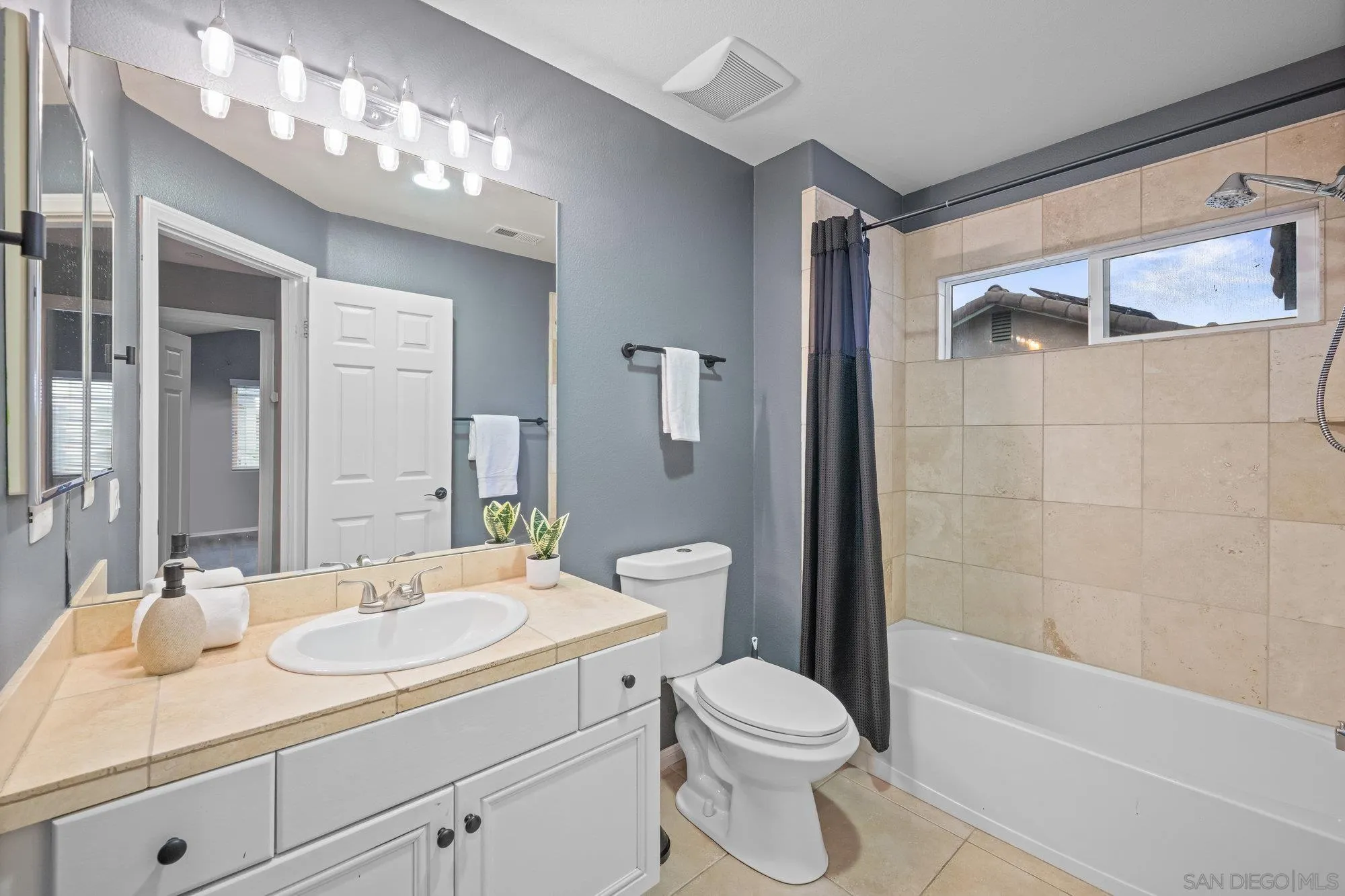 640 Dimaio Way Escondido, CA 92027 - Photo 20 of 31 a bathroom with a sink a toilet and shower