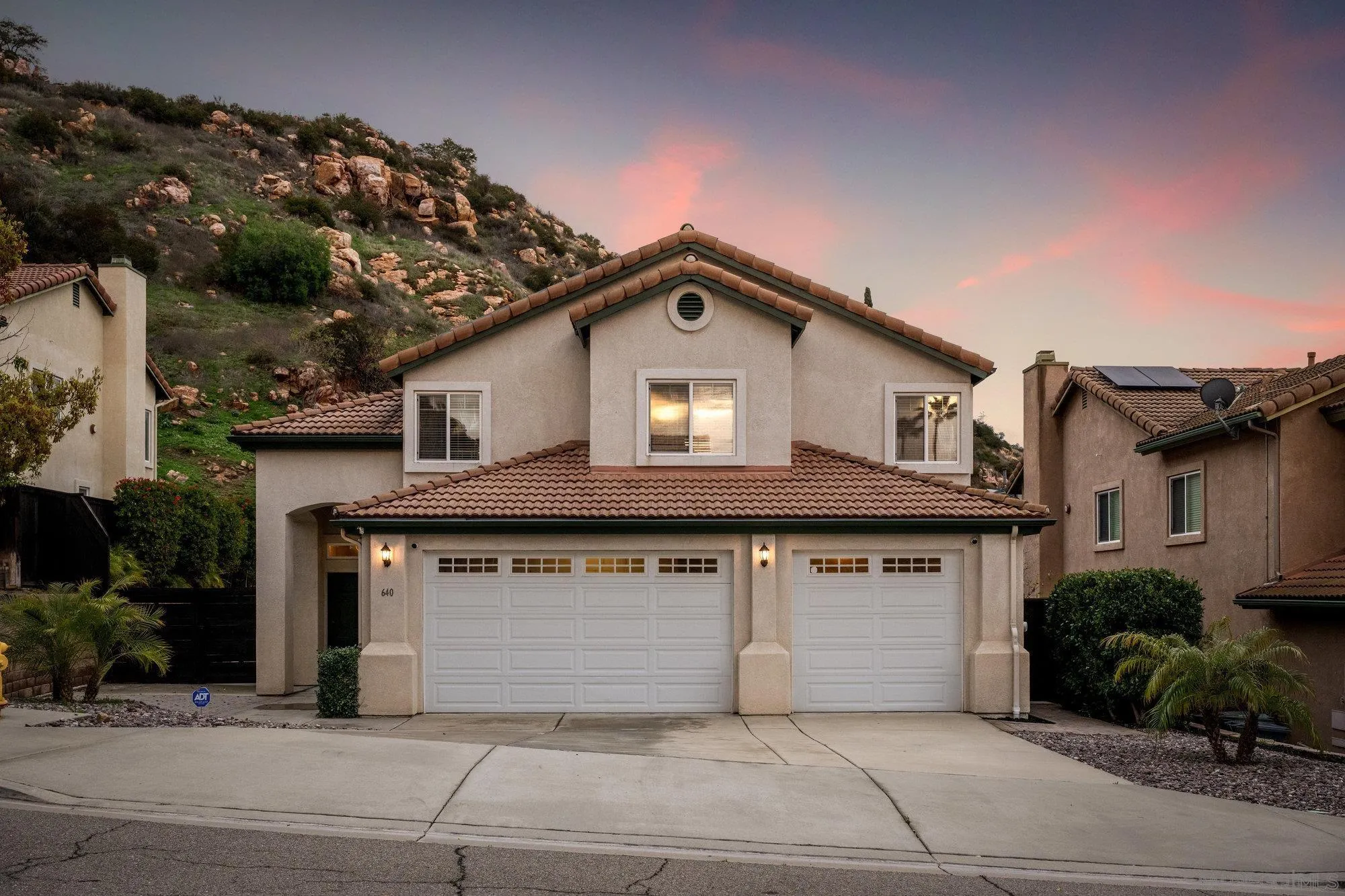 640 Dimaio Way Escondido, CA 92027 - Photo 2 of 31 a front view of a house with a garden and garage