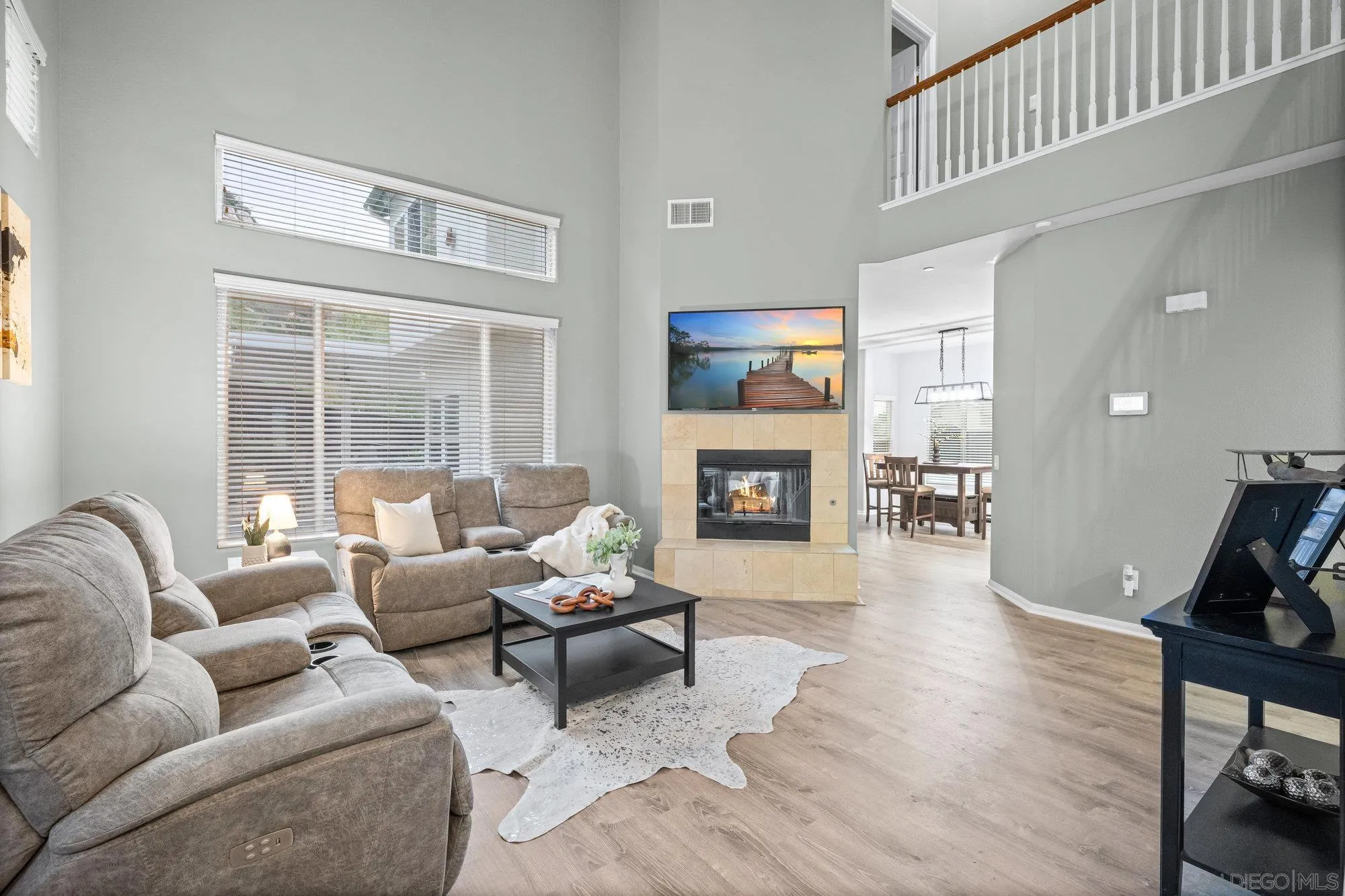 640 Dimaio Way Escondido, CA 92027 - Photo 4 of 31 a living room with furniture a fireplace and a flat screen tv