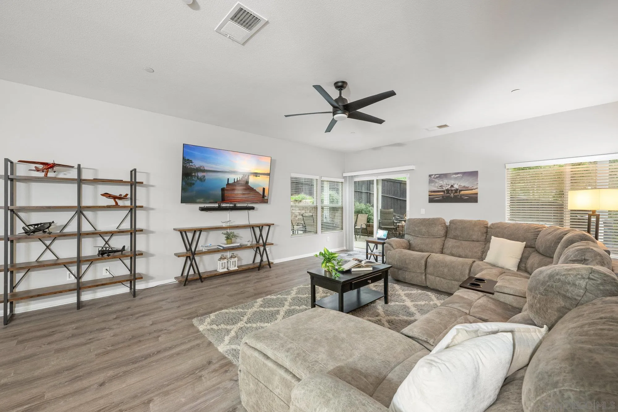 640 Dimaio Way Escondido, CA 92027 - Photo 7 of 31 a living room with furniture and a flat screen tv with wooden floor