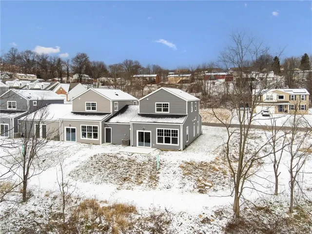 a view of a town with large trees