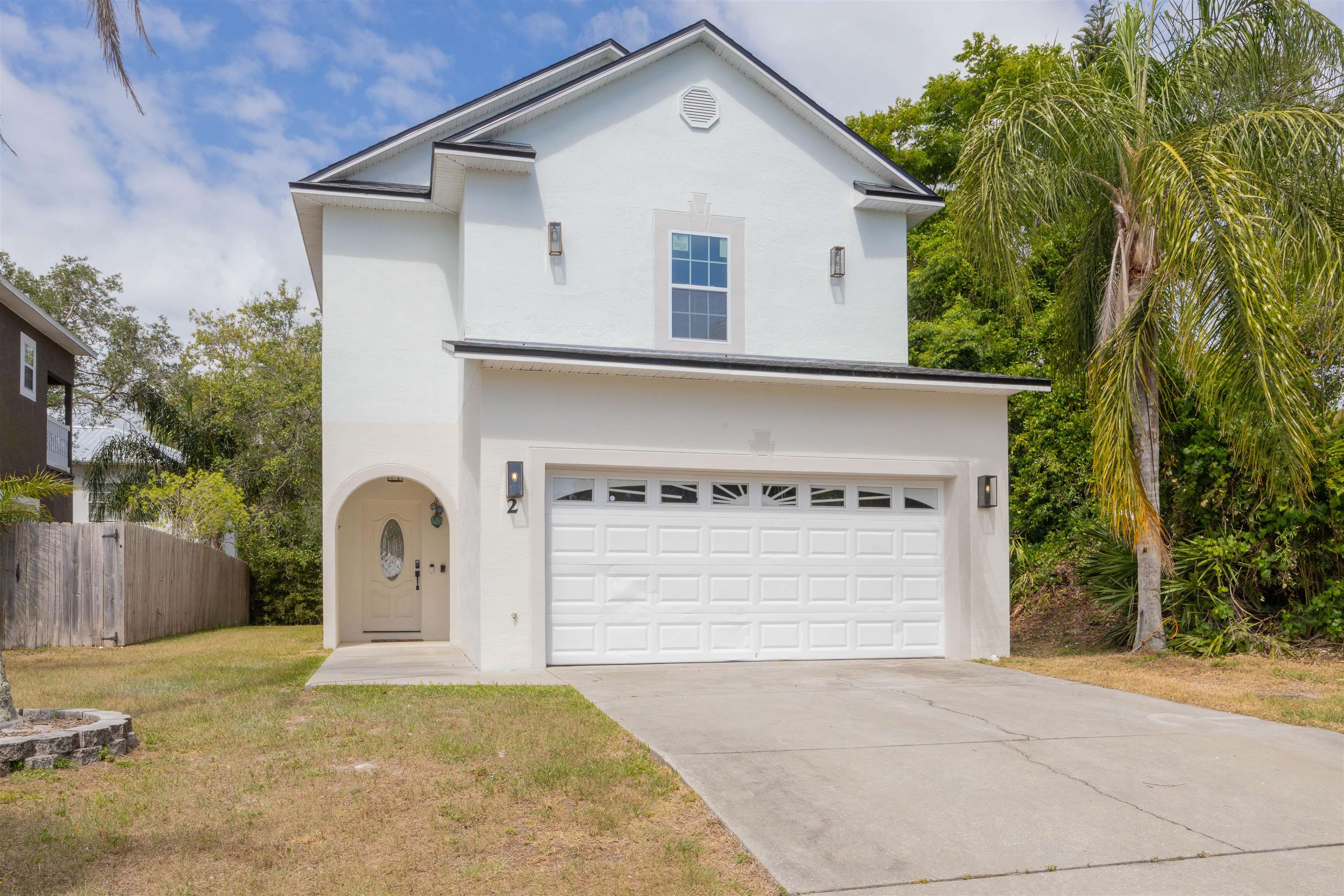 2 Lisbon Street St. Augustine, FL 32080 - Photo 1 of 33 a front view of a house with a yard and garage