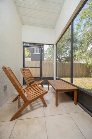 a outdoor space with a large window and sitting area