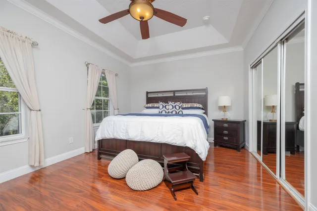 a bed sitting in a bedroom next to a window