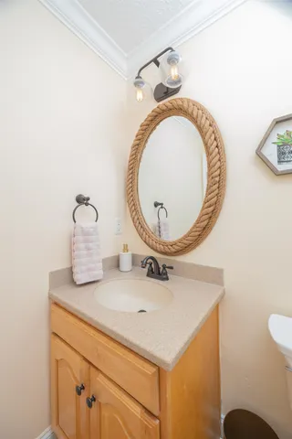 a bathroom with a sink a mirror and a toilet