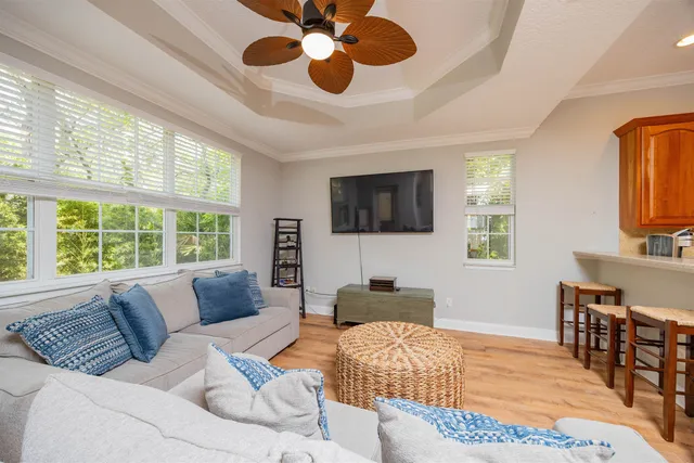 a bedroom with a large bed and a flat screen tv