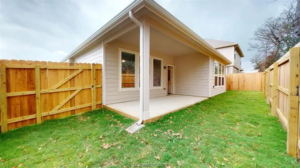 a view of backyard with green space