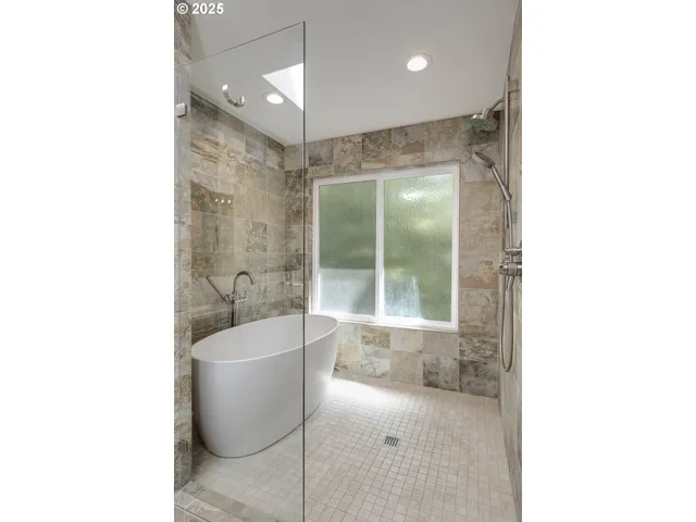 a bathroom with a bathtub and a sink