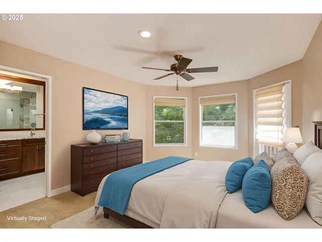 a bedroom with a large bed and a window