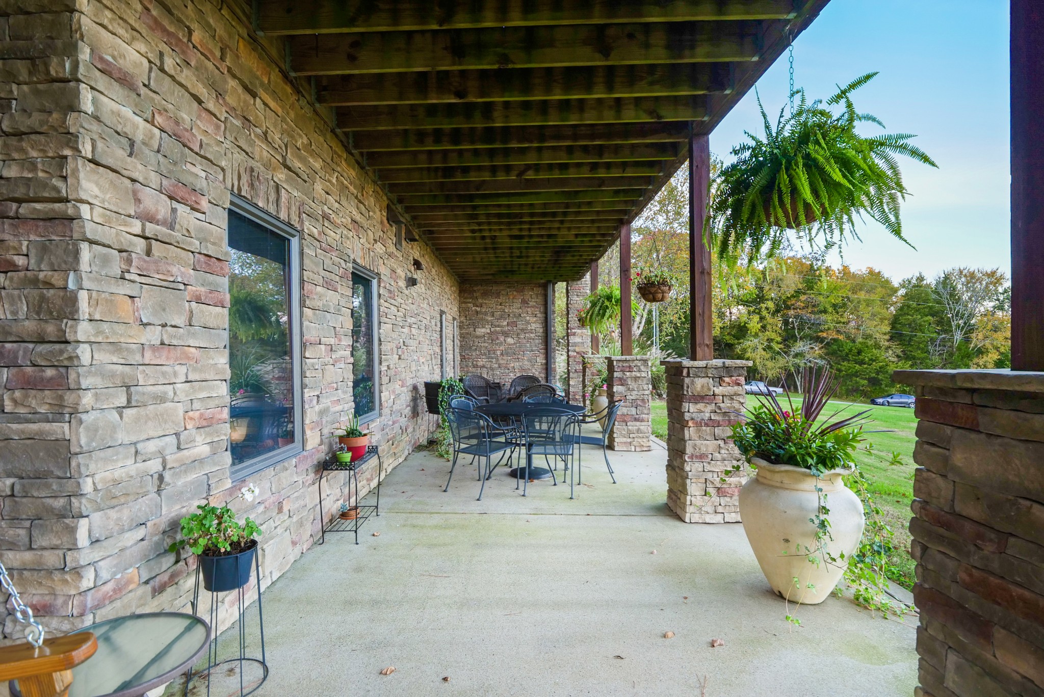 3686 Bluebird Road Lebanon, TN 37090 - Photo 39 of 50 a view of a patio with table and chairs potted plants with wooden fence