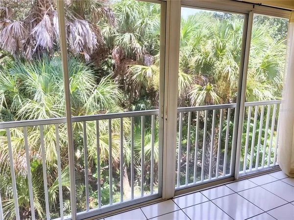 a view of a balcony with plants