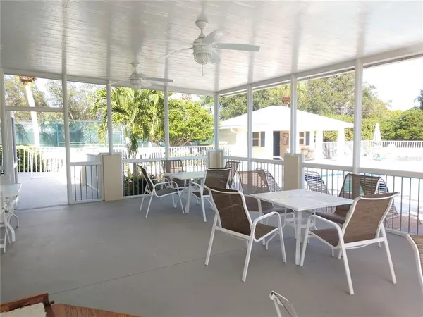 a house view with swimming pool and garden space