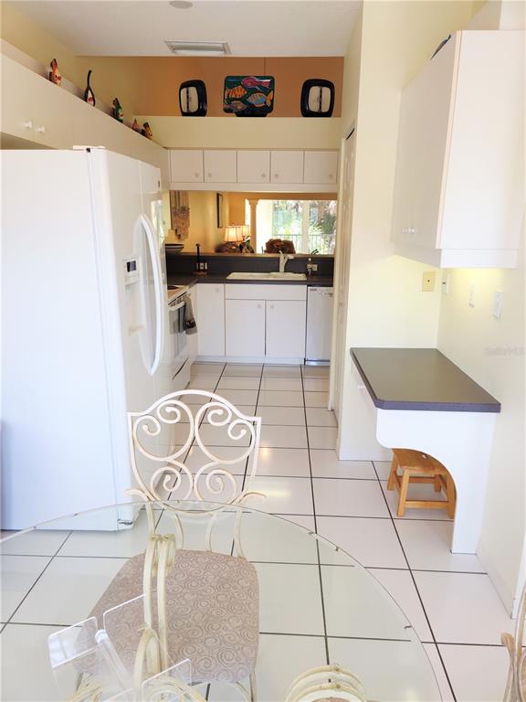 Undisclosed Address Venice, FL 34292 - Photo 7 of 51 a kitchen with stainless steel appliances granite countertop a stove a refrigerator and a microwave