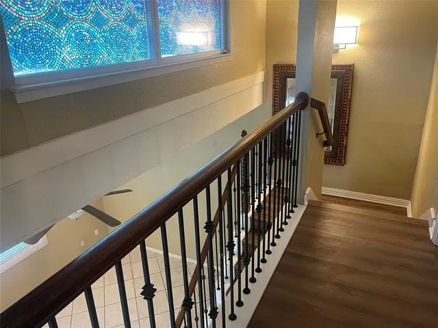 a room with wooden floor and a chair