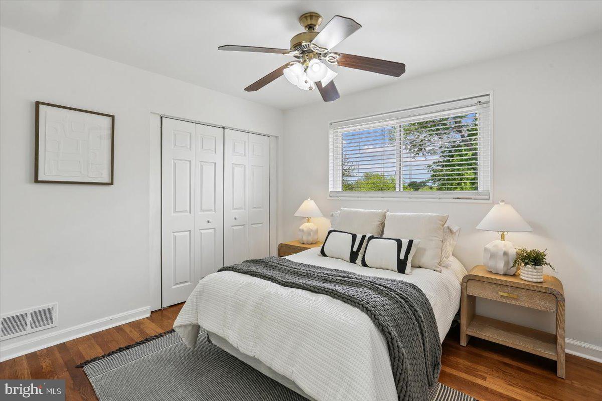 3709 Kenway Street Silver Spring, MD 20906 - Photo 24 of 34 a bedroom with a bed and a chandelier