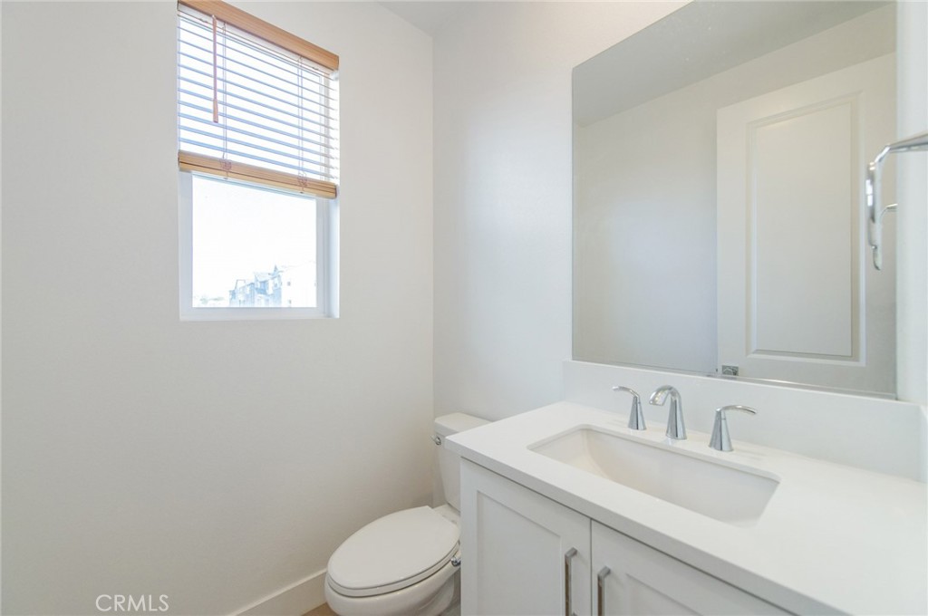 110 Seep Irvine, CA 92618 - Photo 12 of 37 a bathroom with a sink a toilet and a window