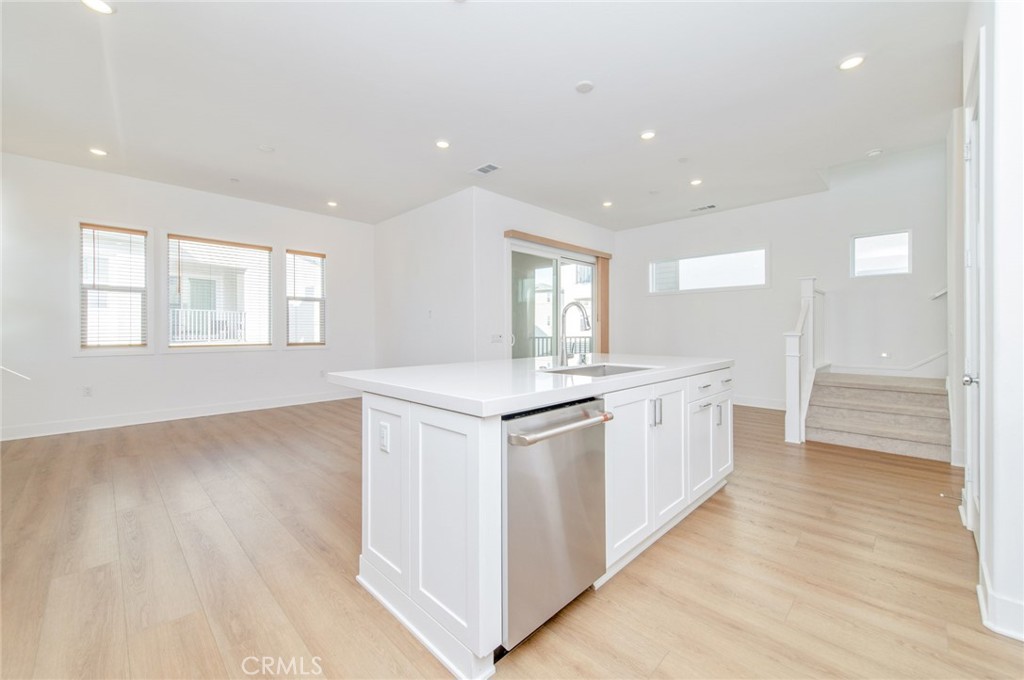 110 Seep Irvine, CA 92618 - Photo 20 of 37 a kitchen with white cabinets and sink