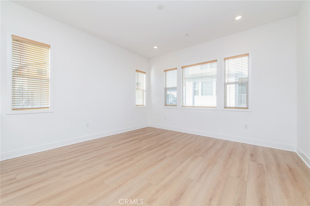 110 Seep Irvine, CA 92618 - Photo 21 of 37 a view of an empty room with wooden floor and a window