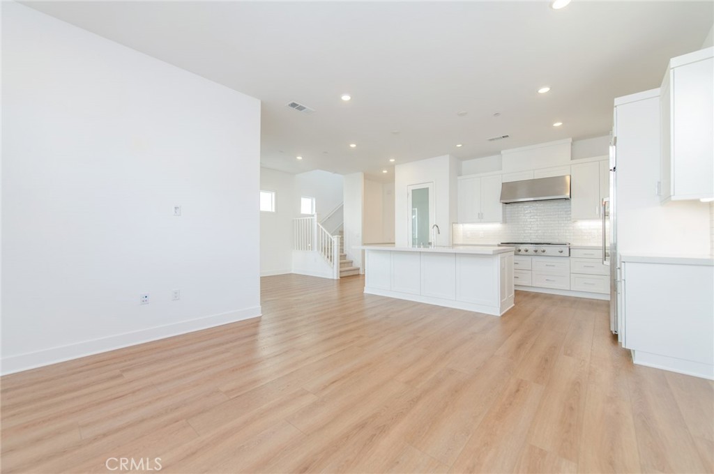 110 Seep Irvine, CA 92618 - Photo 22 of 37 a view of kitchen with wooden floor
