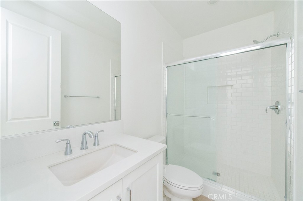110 Seep Irvine, CA 92618 - Photo 34 of 37 a bathroom with a sink toilet vanity and shower