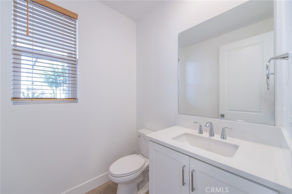 110 Seep Irvine, CA 92618 - Photo 10 of 37 a bathroom with a sink toilet and a mirror