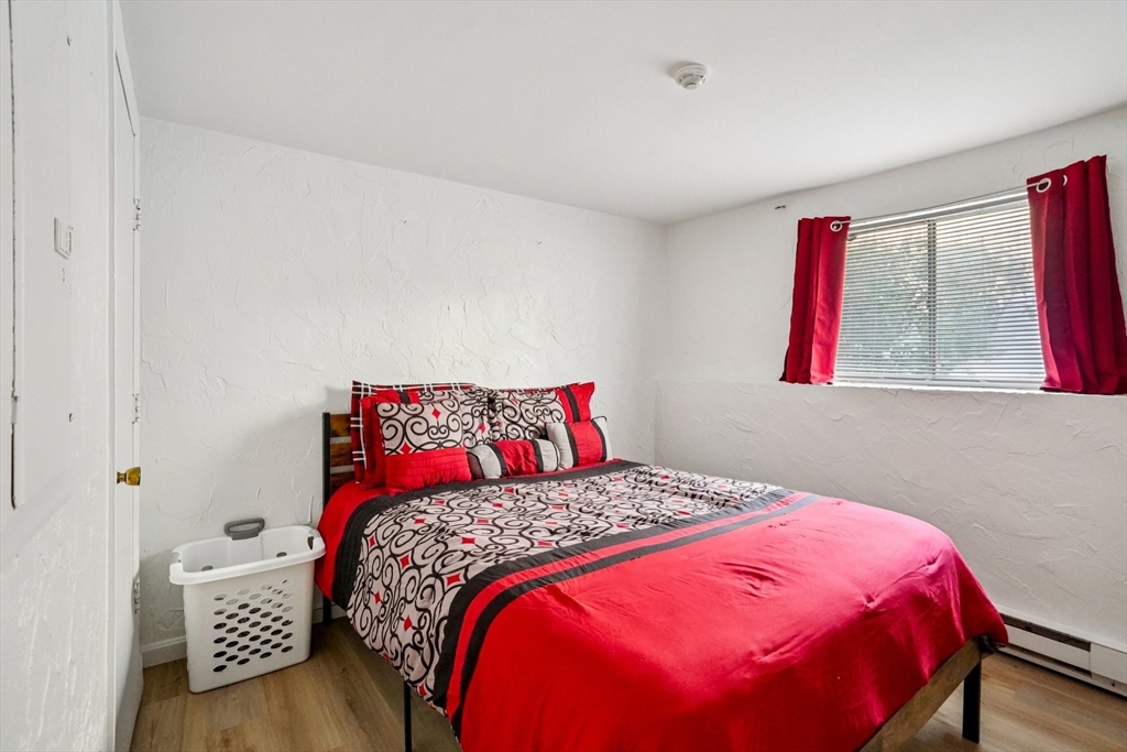 208 Swanson Road, Unit 526 Boxborough, MA 01719 - Photo 10 of 18 a bedroom with a bed and a window