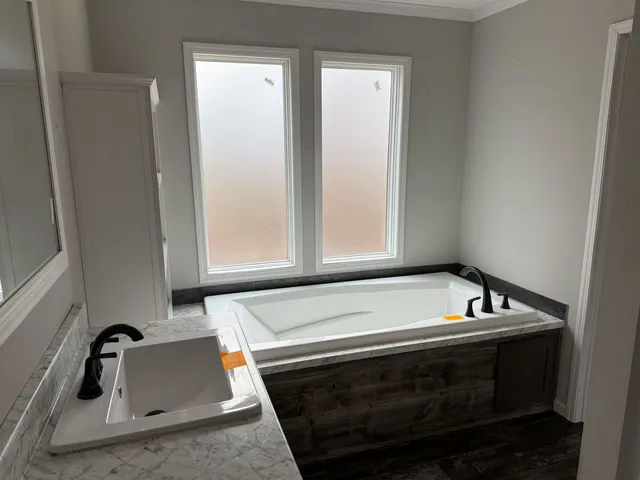 a bathroom with a sink and a bathtub