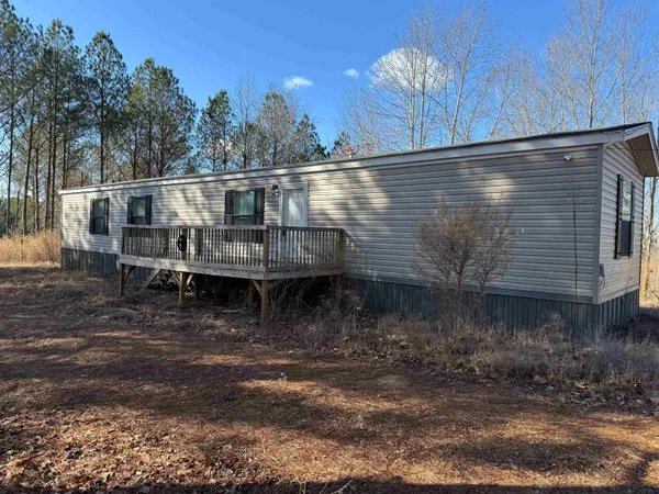 a kitchen with a sink dishwasher a stove and a refrigerator with wooden floor